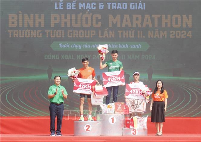 15.000 vận động viên thi tài chạy marathon tại Bình Phước - Ảnh 1.