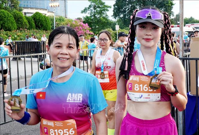 12.000 vận động viên tranh tài tại giải chạy VnExpress Marathon Quy Nhơn 2025 - Ảnh 3. 12.000 vận động viên tranh tài tại giải chạy VnExpress Marathon Quy Nhơn 2025 - Ảnh 3.